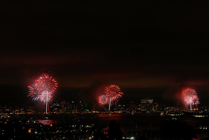 aerial photo of red fireworks in city, Big Bay Boom, Port of San Diego