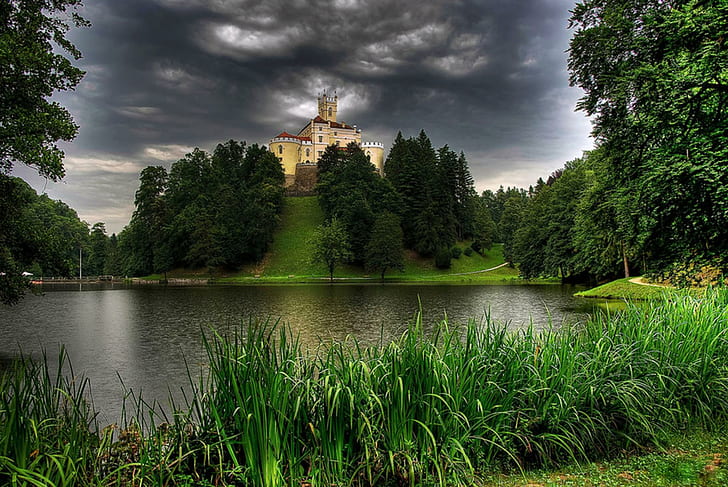 Hilltop Castle, island, stormy, grass, water, reeds, trees, river