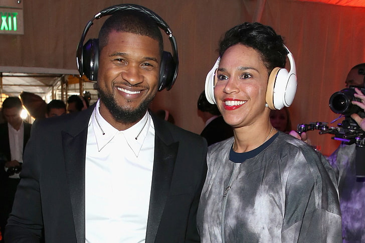 white wireless headphones, usher, grace miguel, spouses, smiling