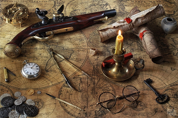 vintage brown flintlock gun, card, watch, candle, key, glasses