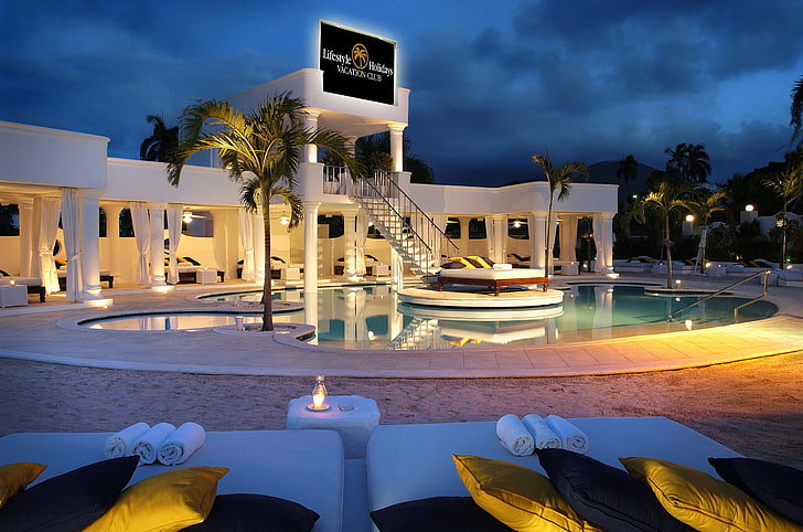 swimming pool and white bulding, club, the evening, pillow, columns