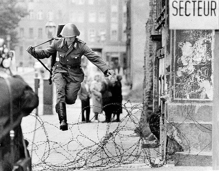 East Germany, Cold War, vintage, Berlin, soldier, jumping, monochrome