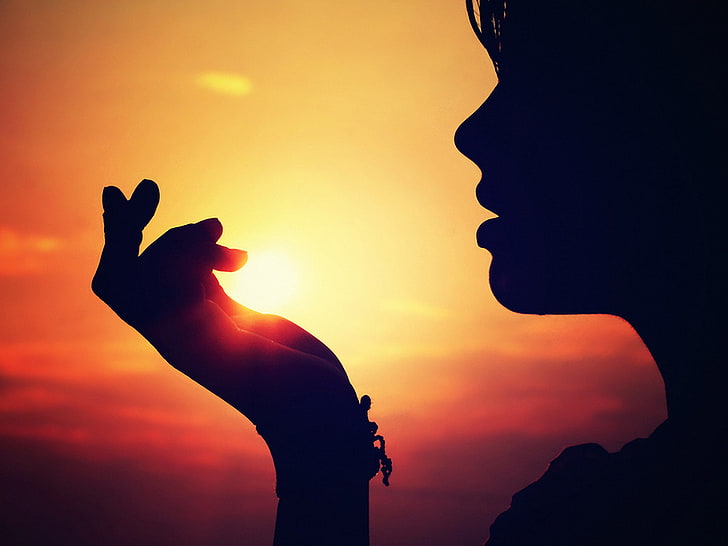 silhouette of woman, girl, sunset, the person's hand, back Lit