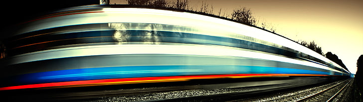 white, blue, and white train, light trails, long exposure, railway