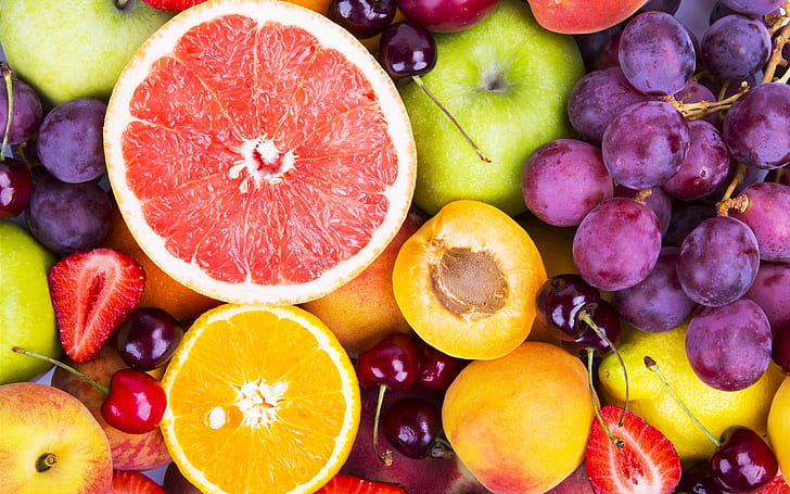 Colorful fruits, berries, oranges, grapes, grapefruit