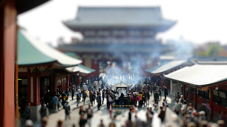 gray and red temple, crowd of people near temple, landscape, tilt shift