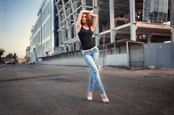 women's black tank top and blue distressed jeans, redhead, hips