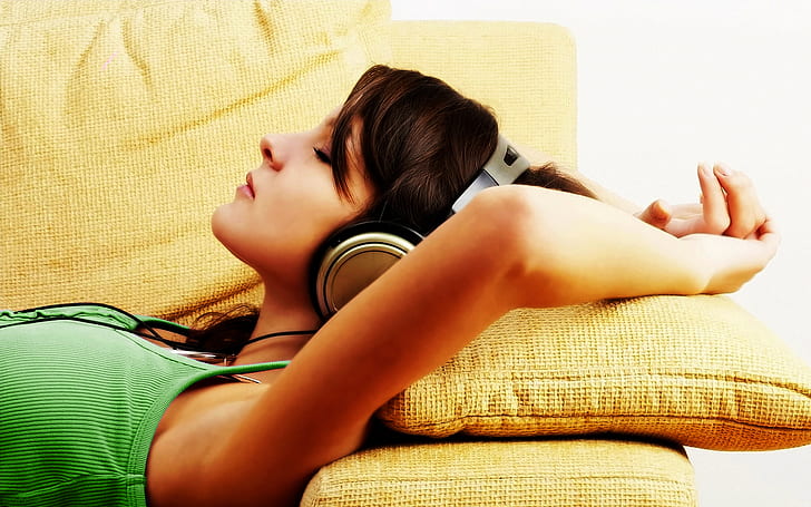 women, headphones, brunette, arms up, relaxing, green top, profile