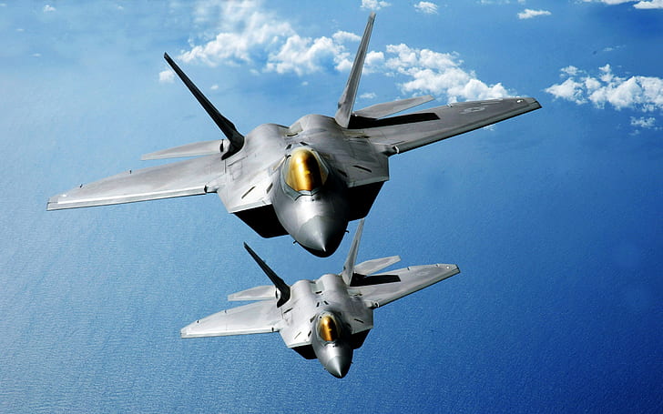 F 22 Raptors Over the Pacific, two gray planes