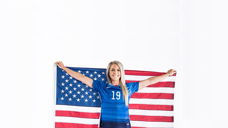 woman wears blue shirt holds U.S. flag, Julie Johnston, American flag