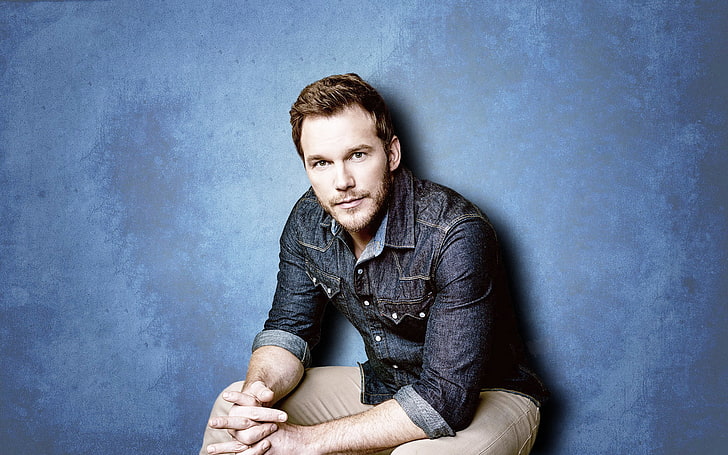 Chris Pratt, actor, blue background, one person, sitting, front view