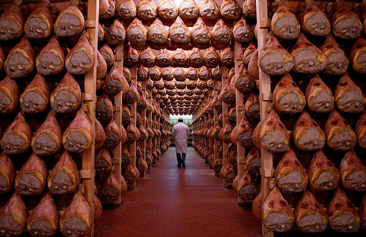 man walking along path, meat, butchers, large group of objects