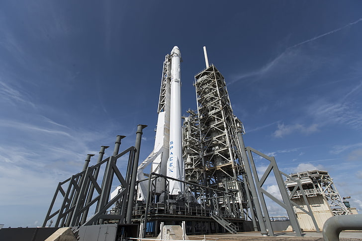 white and brown concrete building, SpaceX, rocket, clouds, low angle view