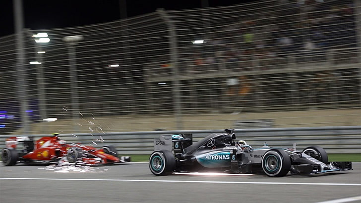 two red-and-black Formula 1 cars, Mercedes-Benz, Mercedes AMG Petronas