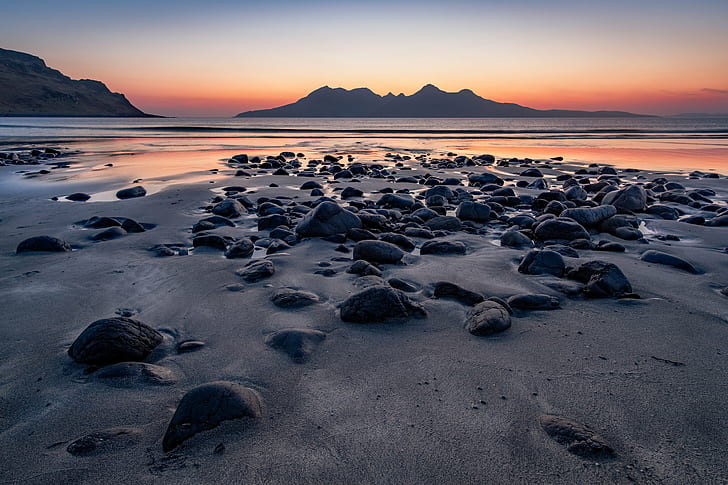 focus photo of grey stones on shore with a view of mountains afar at sunset, HD wallpaper