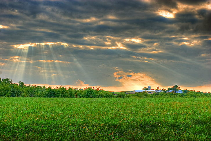 Landscape photography of green pastures under commulus stratus clouds during golden hour, wisconsin, wisconsin