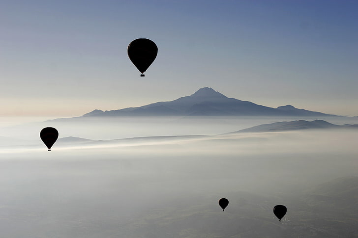 four hot air balloons, simple background, white, clouds, mountains