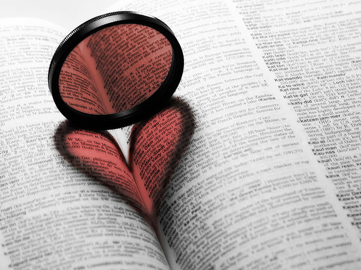 round black lens, red, heart, dictionaries, paper, publication