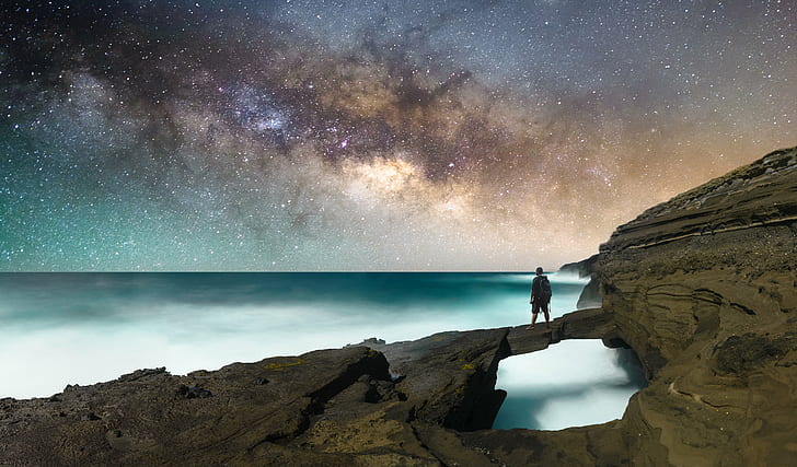man on top of rock formation near ocean, D600, Milky Way, Stars
