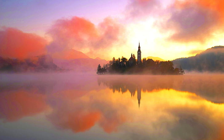 Lake Bled, northwestern Slovenia, warm morning sun, fog