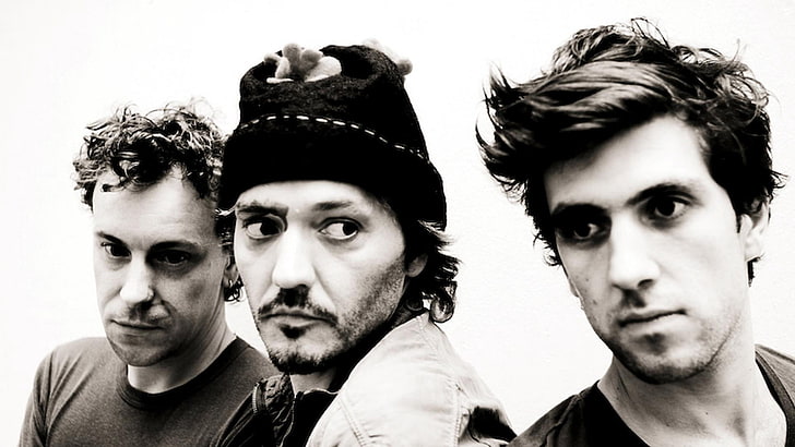 grayscale photo of three men band, david bartholome, faces, look