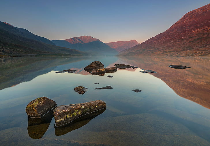 landscape photography of rock on body of water surrounded by mountains, llyn ogwen, snowdonia, llyn ogwen, snowdonia