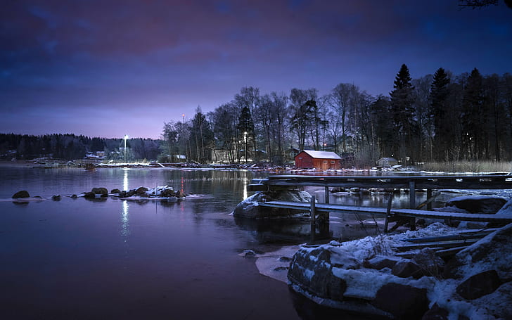 brown wooden garden shed near body of water during night, kotka