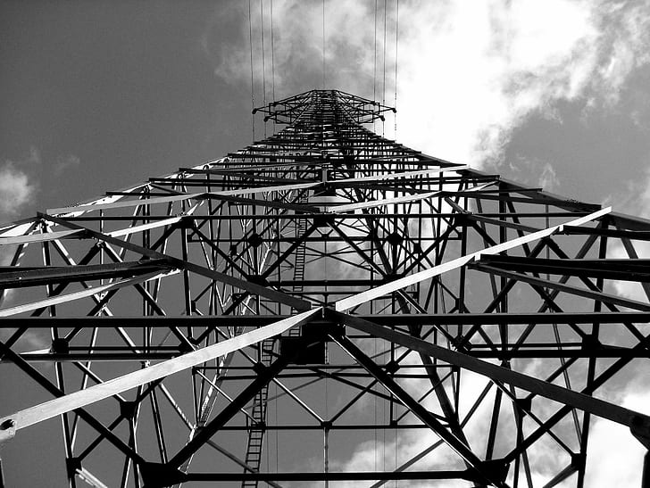 low angle photography of grey metal frames under cloudy sky, Pylon
