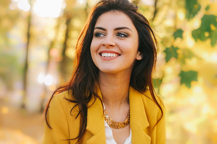 selective focus photography of woman wearing yellow notched lapel blazer