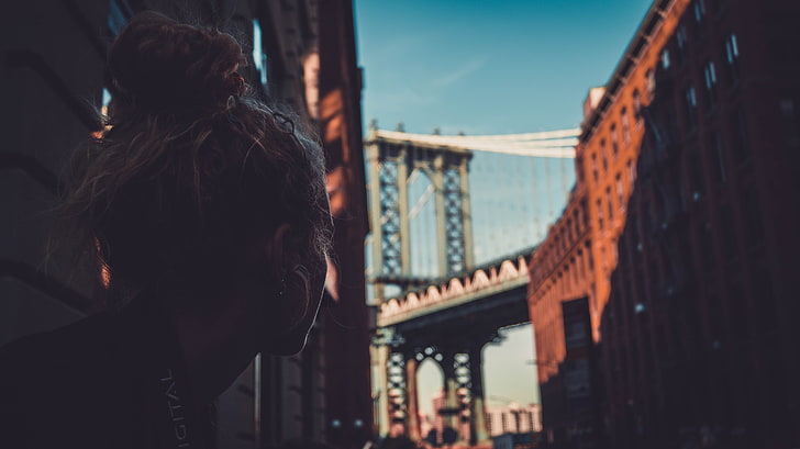 women's black top, dumbo, Manhattan Bridge, New York City, curly hair