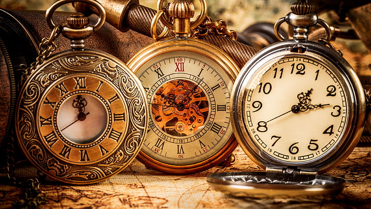 three silver-colored and gold-colored pocket watches, clocks
