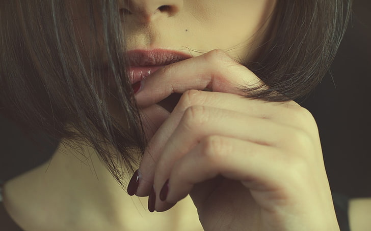 women's red lipstick, woman touching her lips, brunette, macro