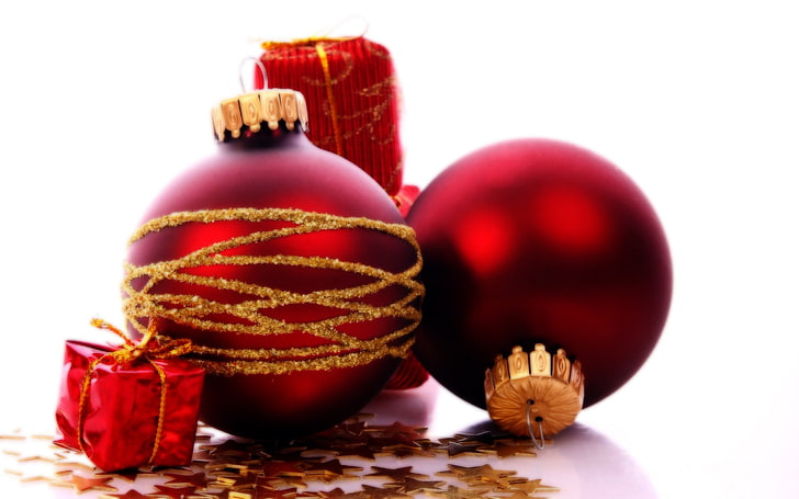 two red-and-gold-colored baubles, New Year, snow, Christmas ornaments