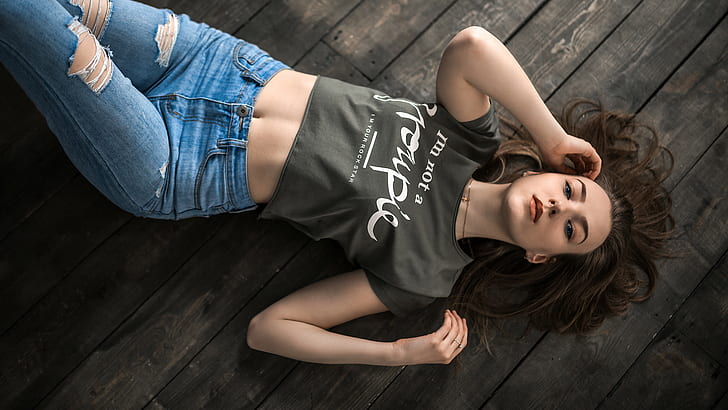 lying on front, top view, T-shirt, belly, wooden surface, torn jeans, HD wallpaper