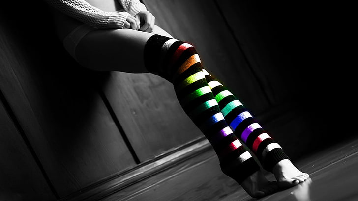 pair of women's black-and-multicolored striped socks, thigh-highs