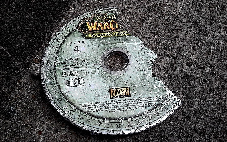 World of Warcraft disc, broken, close-up, text, metal, communication