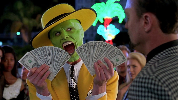 Joker holding fan of U.S. dollar bill lot, The Mask, money, film stills