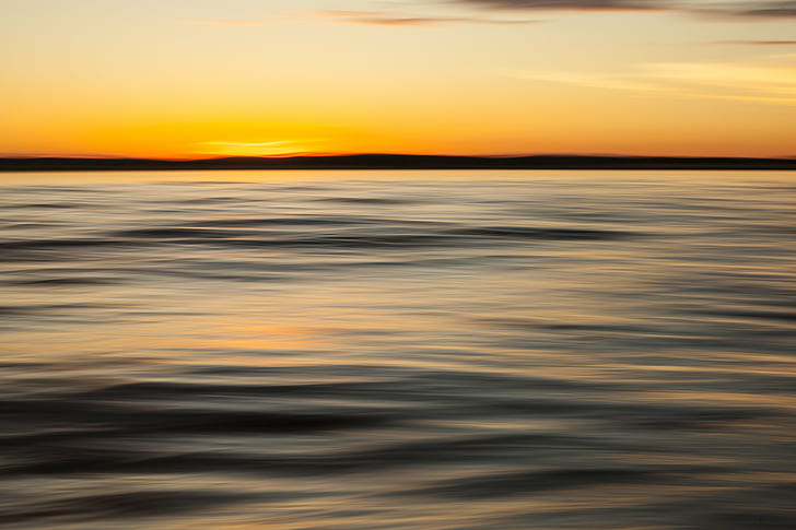 photo of calm body of water during daytime, Setting Sun, sunset