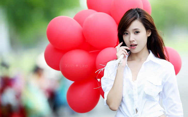 women's white button-up shirt, brunette, asian, balloons, conversation