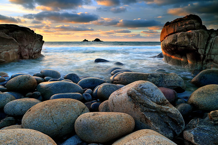 gray and brown stones beside body of water during sunset, Porth Nanven