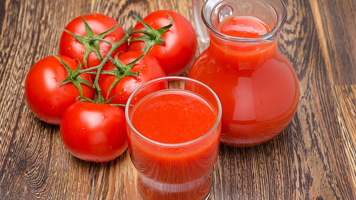 clear glass pitcher and drinking glass, tomatoes, juice, table