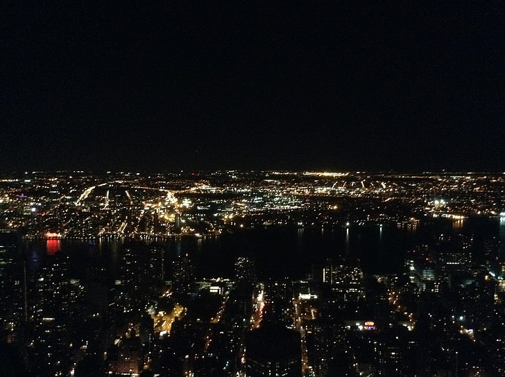 lighted city buildings, New York City, night, cityscape, illuminated