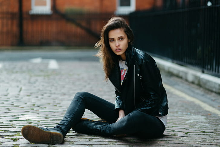 sitting, brown eyes, leather jackets, skinny jeans, open mouth