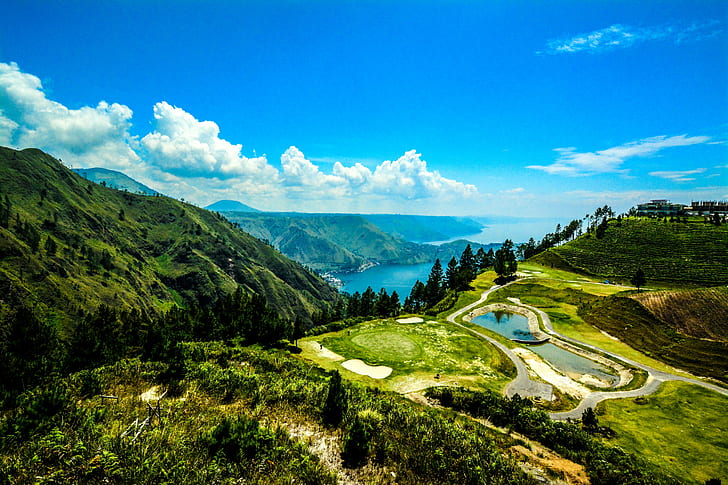 Indonesia, Lake Toba, Sumatra, green hills near blue sea, mountains