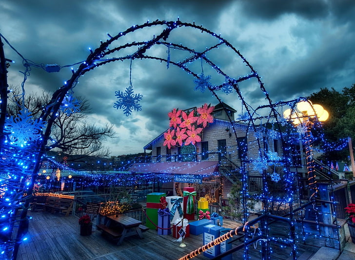 blue string lights, snowflakes, arch, garlands, street, gifts