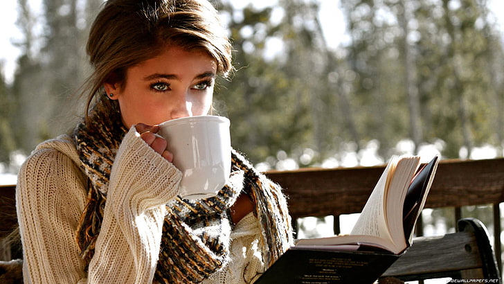white mug, girl wearing sweater and scarf drinking tea, model