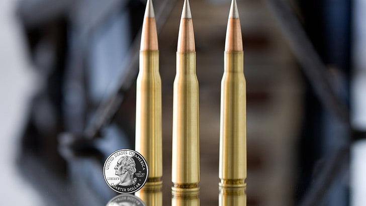 three rifle bullets, ammunition, coins, money, metal, hanging