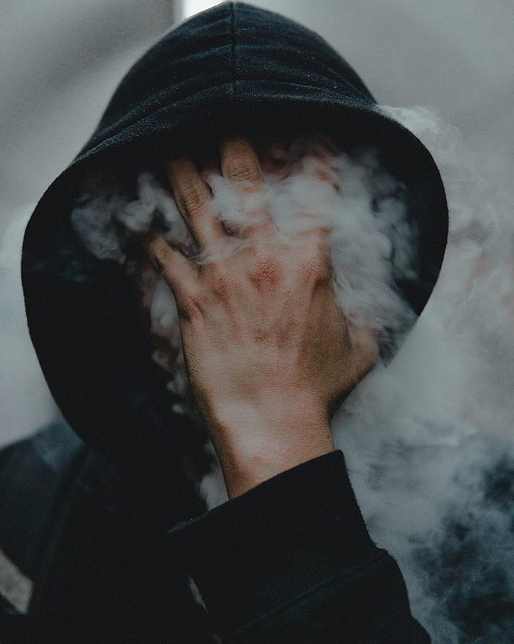 people, smoke, touching face, covering face, vertical, black clothing