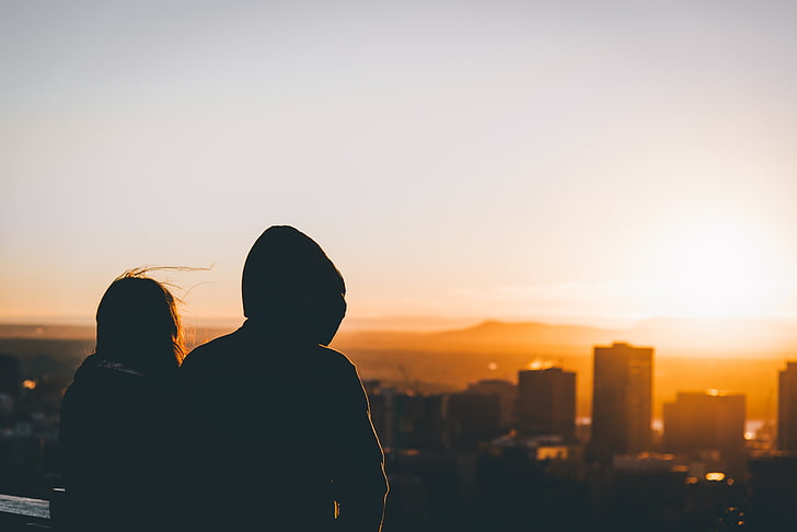 silhouette of two people looking at buildings, city, cityscape