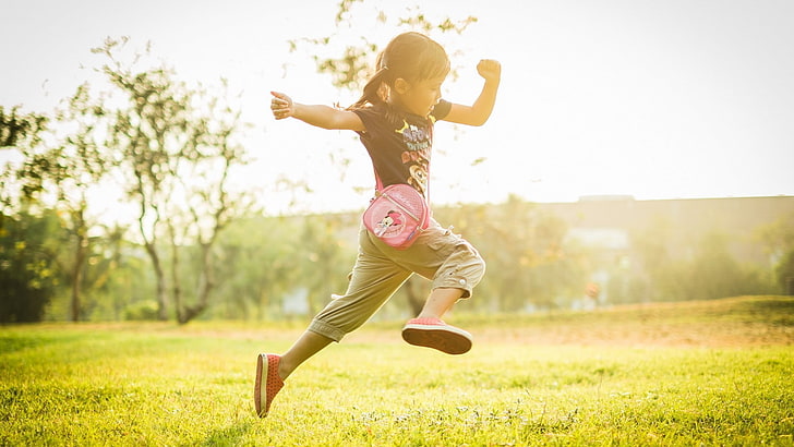 girl jumping on grass, children, field, sunlight, blurred, pigtails